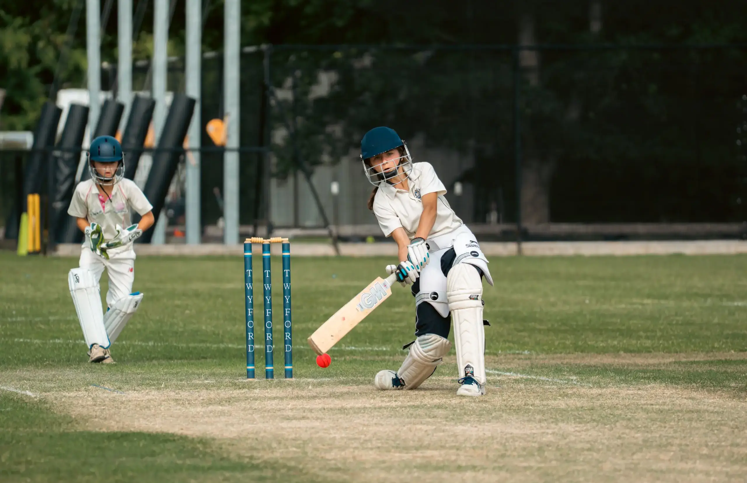 Students playing cricket