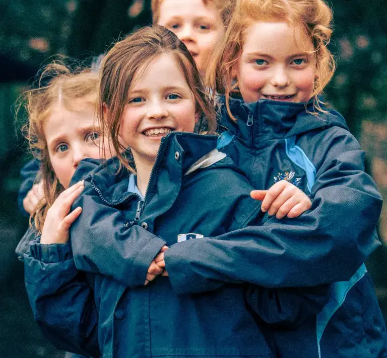School girls huggin