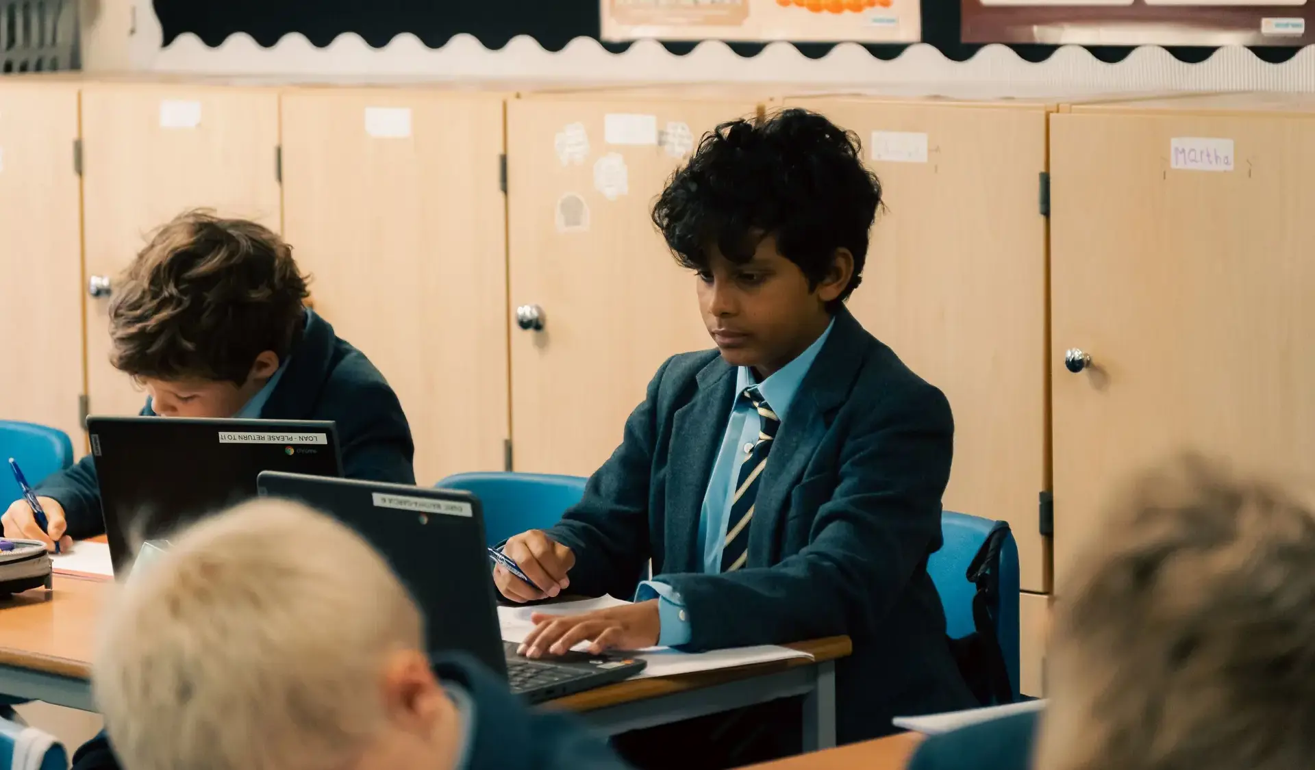 Children studying with laptop