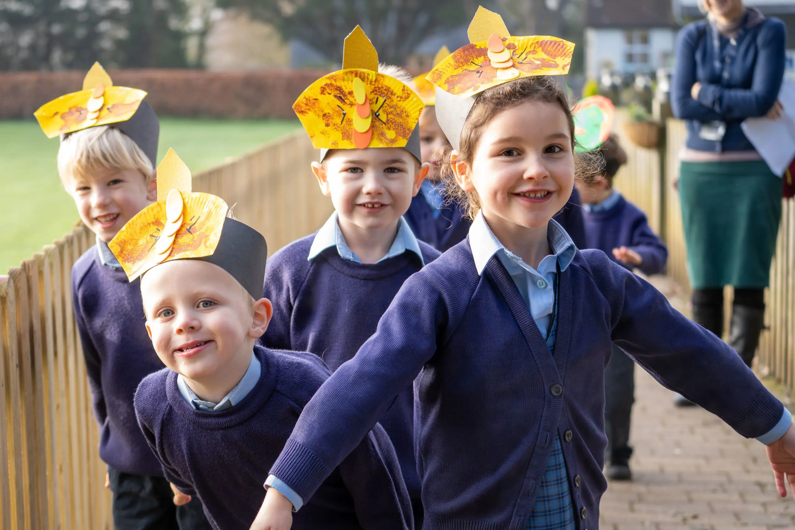 young children wearing creative hats