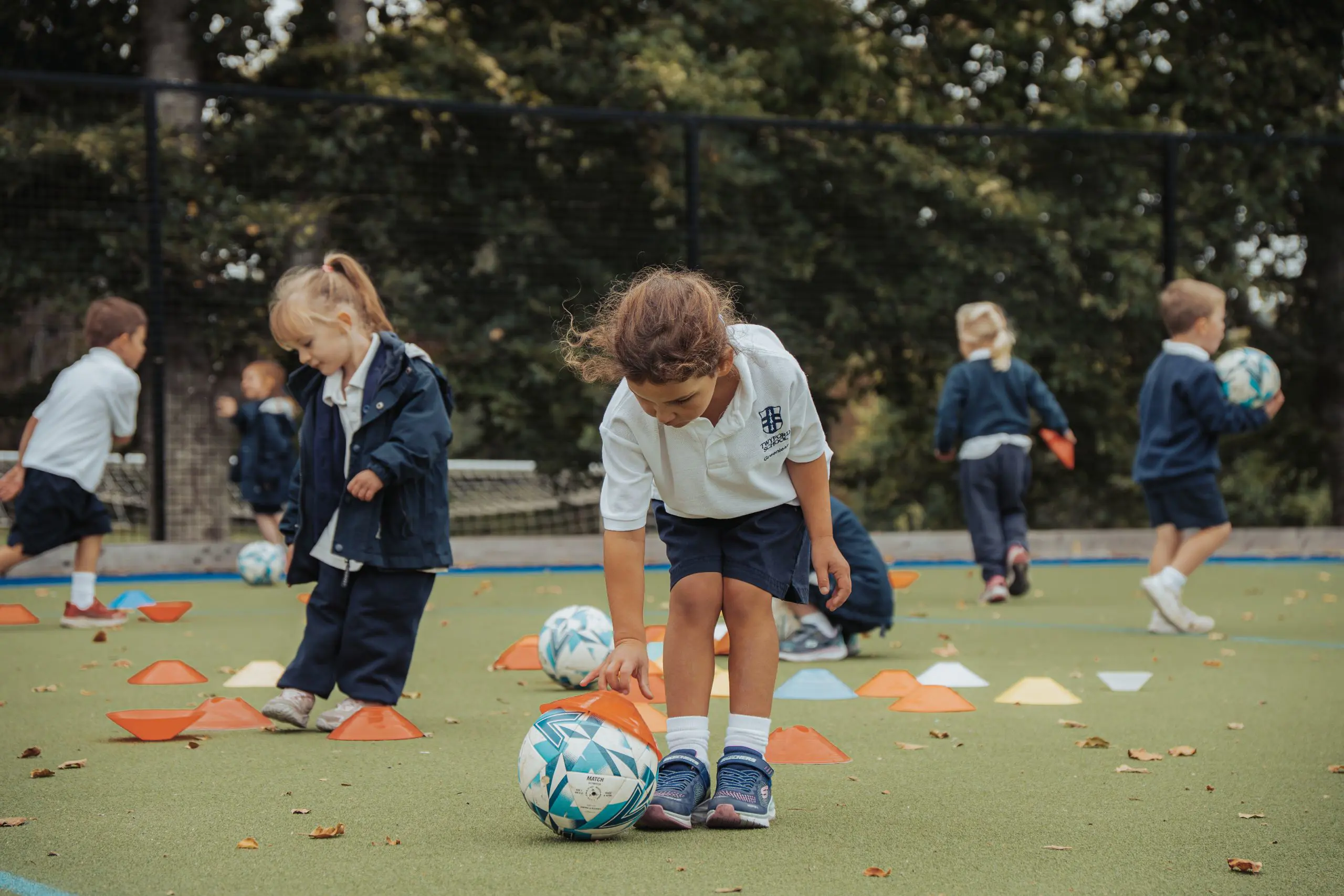 Young children playing football