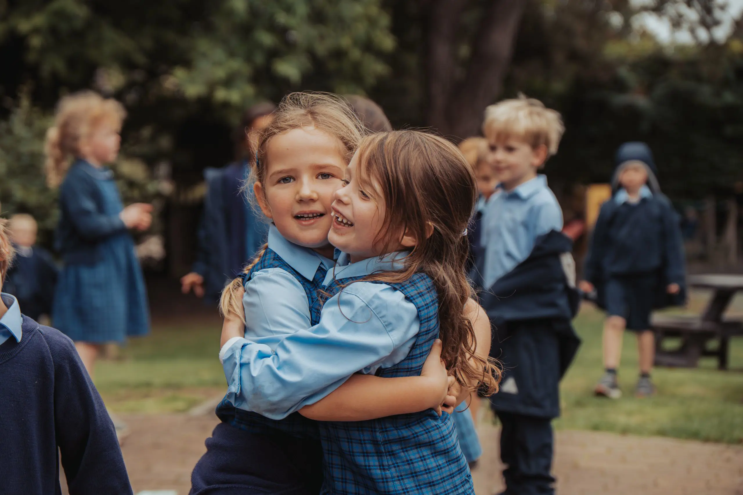 Two girls hugging