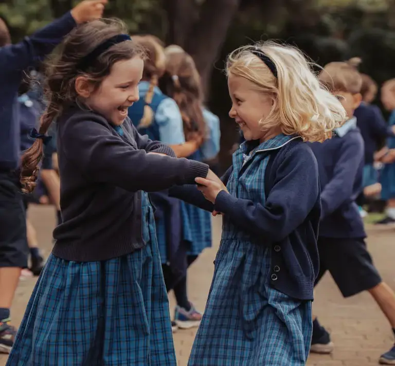Kids in uniform being playful