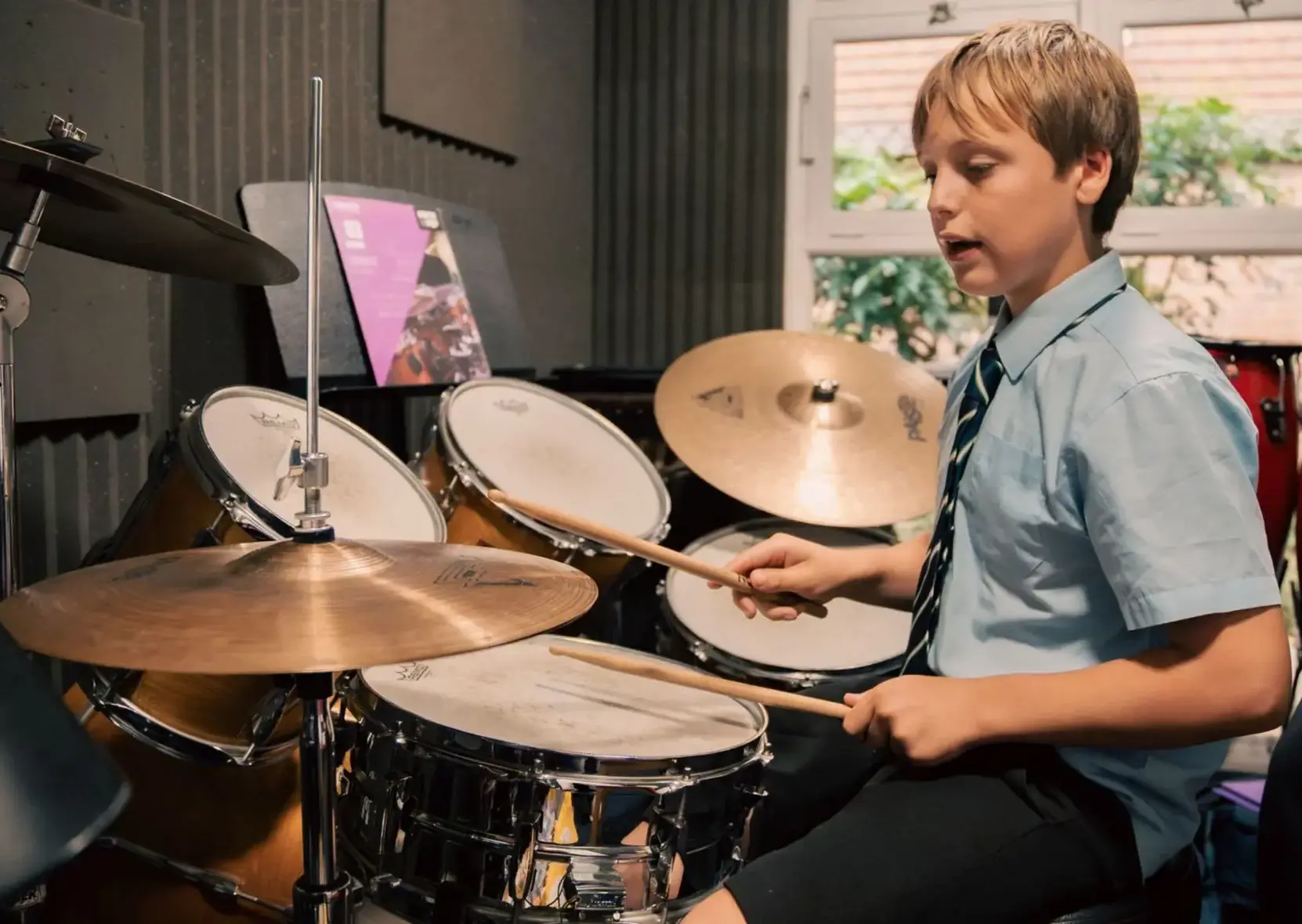 Boy playing drums