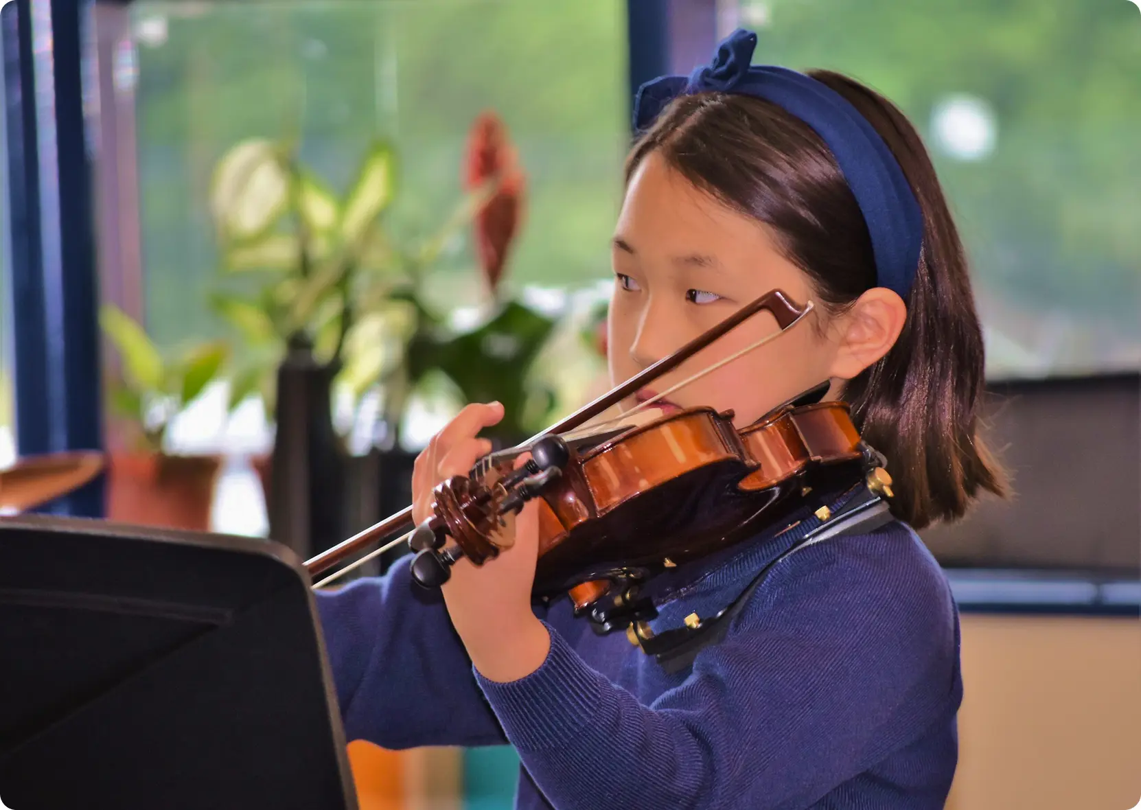 Young girl playing violin